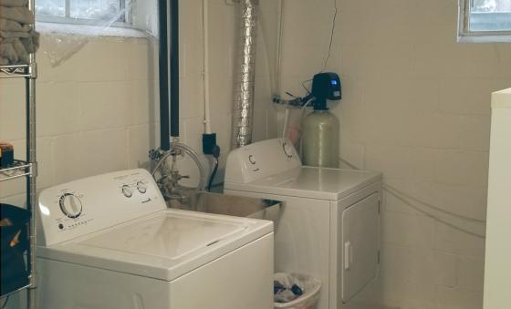 water and dryer in a basement